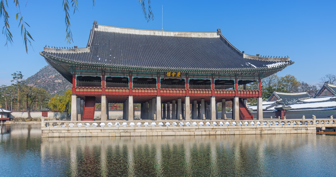 A large building sitting next to a body of water
