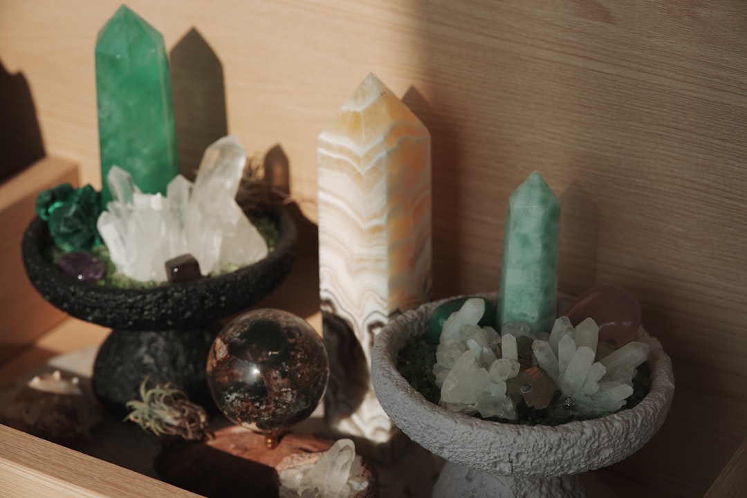 Various crystals and stones arranged on shelves.