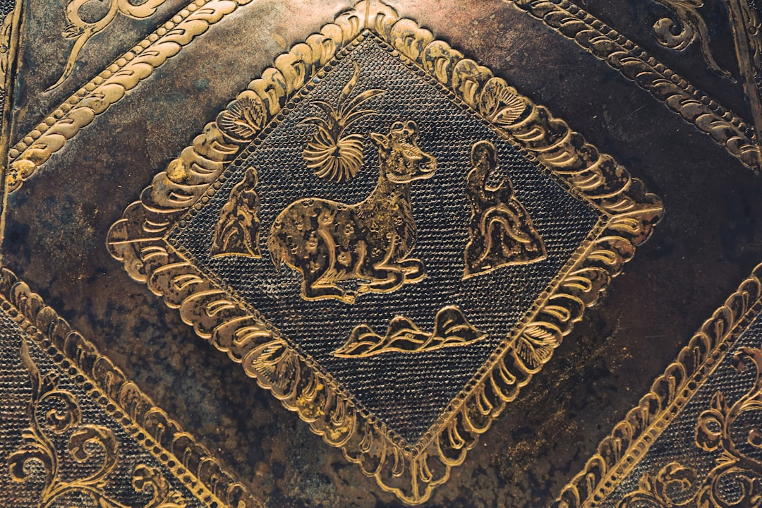 Ornate metalwork with a central diamond-shaped motif.
